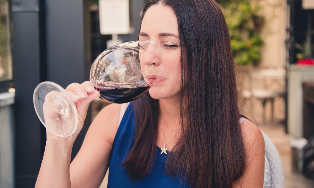 Woman sampling red wine