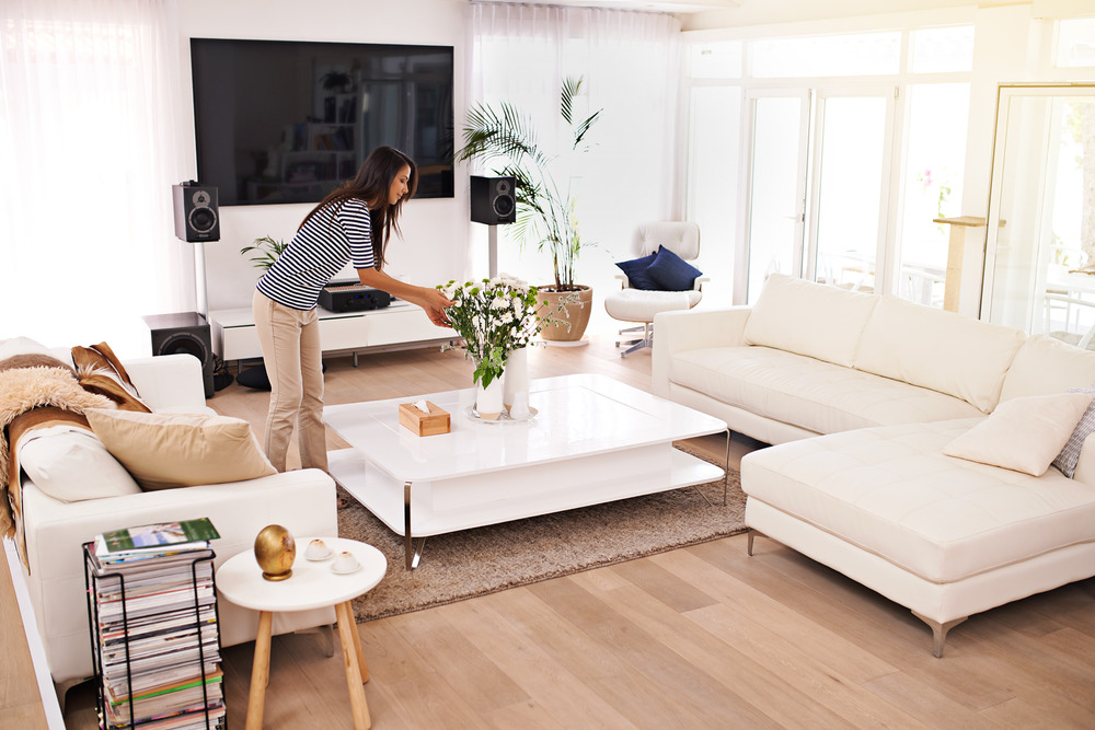 woman decorating her living room with flowers