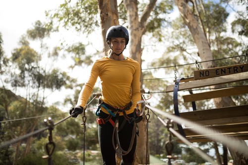 Woman on zipline in adventure park