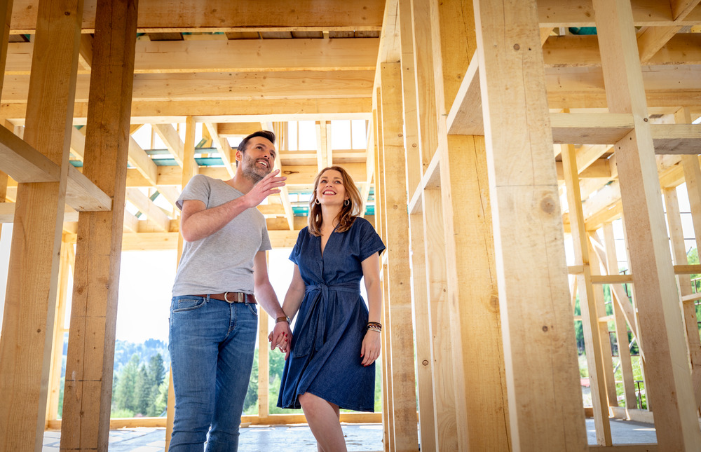the costs of building vs buying a home Couple building their own home